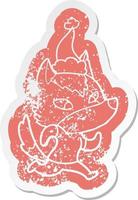 friendly cartoon distressed sticker of a wolf wearing santa hat vector