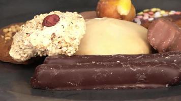 Loopable selective focus view of delicious and freshly baked cookies on a plate in close up view. video