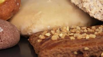 Loopable selective focus view of delicious and freshly baked cookies on a plate in close up view. video