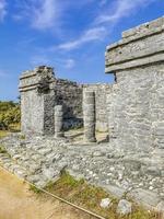 Ancient Tulum ruins Mayan site temple pyramids artifacts seascape Mexico. photo