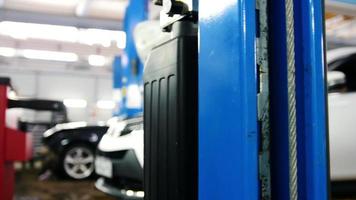 Blue car lift - automobile service, slider video