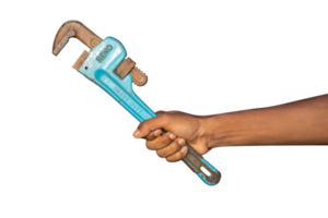 Plumbing wrench in male hand isolated on PNG