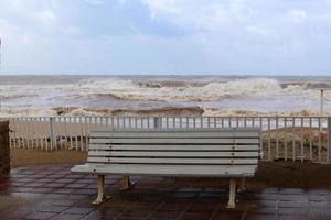 Bench in a city park on the Mediterranean coast photo