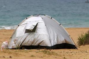 Tent for rest on the shores of the Mediterranean Sea. photo