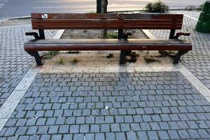 Bench in a city park on the Mediterranean coast photo