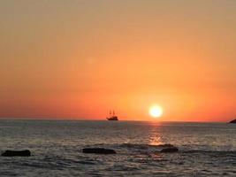 Sunset Sea with boat photo