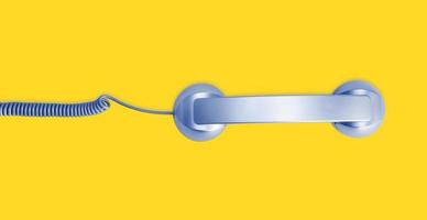 Telephone handset isolated on yellow background. Contact us banner. Top view photo