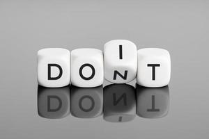 Flip cube block with word dont change to do it. Negative mindset to positive thinking concepts photo