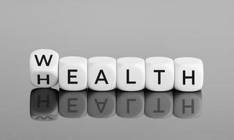 Wealth and Health concept. Flipping cube block with text photo