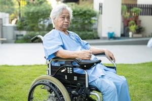 Asian senior or elderly old lady woman patient on electric wheelchair with remote control at nursing hospital ward, healthy strong medical concept photo