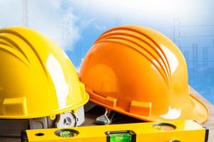 Construction helmet and calculator for engineering work project at site. photo