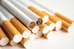 Cigarette, tobacco in roll paper with filter tube, No smoking concept. photo