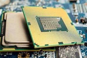 CPU, central processor unit chip Chip on circuit board in PC and laptop computer technology. photo