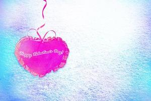 Background from snow. Heart. photo