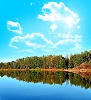 Lake in autumn forest photo