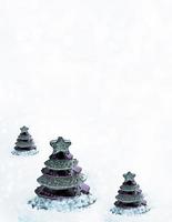 Glass toy Christmas tree in snow. photo