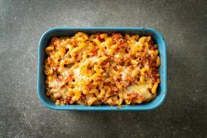 homemade macaroni bolognese with cheese photo