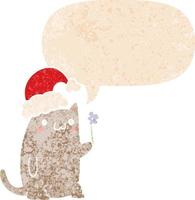 cute cartoon christmas cat and speech bubble in retro textured style vector