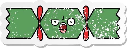 distressed sticker of a cute cartoon christmas cracker vector