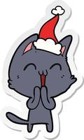 happy sticker cartoon of a cat wearing santa hat vector