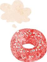 cartoon donut and thought bubble in retro textured style vector