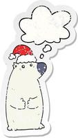 cartoon bear wearing christmas hat and thought bubble as a distressed worn sticker vector