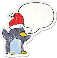 cute cartoon christmas penguin and speech bubble distressed sticker vector