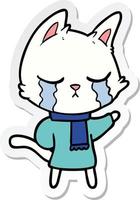 sticker of a crying cartoon cat wearing winter clothes vector