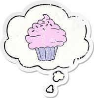 cartoon cupcake and thought bubble as a distressed worn sticker vector