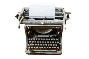 old vintage dust-covered typewriter with sheet of paper isolated on white background photo