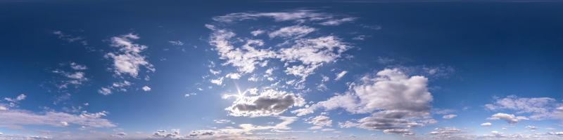 blue sky with beautiful fluffy clouds without ground. Seamless hdri panorama 360 degrees angle view for use in 3d graphics or game development as sky dome or edit drone shot photo