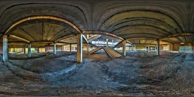 Full spherical seamless hdri panorama 360 degrees angle view concrete structures stairs abandoned unfinished building of airport. 360 panorama in equirectangular equidistant projection, VR AR content photo