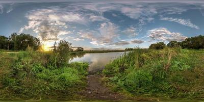 full seamless spherical panorama 360 by 180 angle view on the shore of small lake in sunny summer evening with awesome clouds in equirectangular projection, skybox VR virtual reality content photo