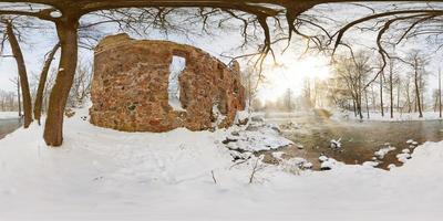 full seamless spherical panorama 360  degrees angle view near ruined water mill narrow fast river in a winter sunny evening. 360 panorama in equirectangular projection. VR AR virtual reality content photo