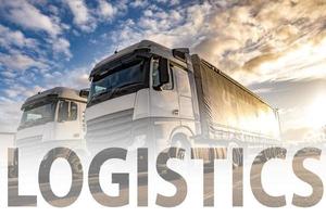 Trucks in a row with containers in the parking lot. Logistic and Transport concept photo