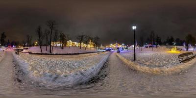 winter full spherical seamless panorama 360 degrees angle view in night park with new year illumination in equirectangular equidistant projection. VR AR content photo