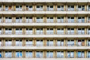 rows of windows in fasade of an abandoned building photo
