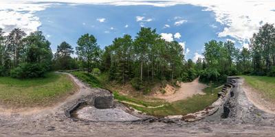 Full seamless 360 degrees angle  view panorama on the ruined abandoned military fortress of the First World War in the forest in equirectangular spherical projection. Ready for VR AR content photo