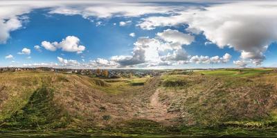 full seamless spherical panorama 360 degrees angle view view from the mountain to the village with awesome clouds. 360 panorama  in equirectangular projection, ready VR AR virtual reality content photo