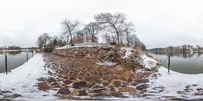 winter fairy tale full seamless spherical panorama 360 degrees angle view on the shore of width river neman in cloudy day in equirectangular projection, ready VR AR virtual reality content photo