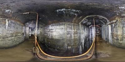 full seamless panorama 360 degrees angle view inside ruined abandoned military underground casemates fortress of the First World War in equirectangular spherical projection photo