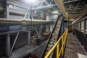 moving conveyor transporter on Modern waste recycling processing plant. Separate and sorting garbage collection. Recycling and storage of waste for further disposal. photo