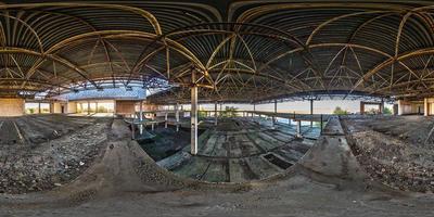 Full spherical seamless hdri panorama 360 degrees angle view concrete structures abandoned unfinished building of airport in equirectangular equidistant projection, VR AR content photo