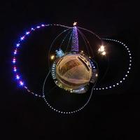 New year little planet.  Spherical aerial 360 degree panorama night view on a festive square with a Christmas tree photo