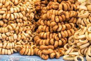 bundle of fresh yellow bagels. A popular kind of flour products. One of the traditional treats for tea photo