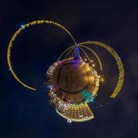 New year little planet.  Spherical aerial 360 degree panorama night view on a festive square with a Christmas tree photo