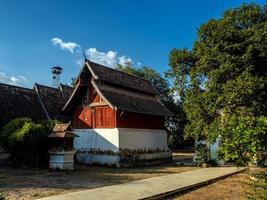 Ancient old wooden building in the clear blue sky day photo