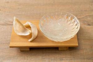 Edible bird's nest soup in glass bowl photo