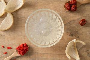 Edible bird's nest soup in glass bowl photo