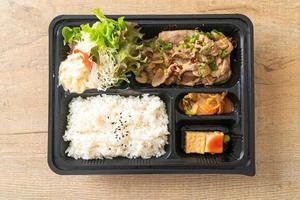 Japanese rice with pork yaki bento set photo